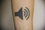 dumbest-tech-tattoo-apple-volume-button